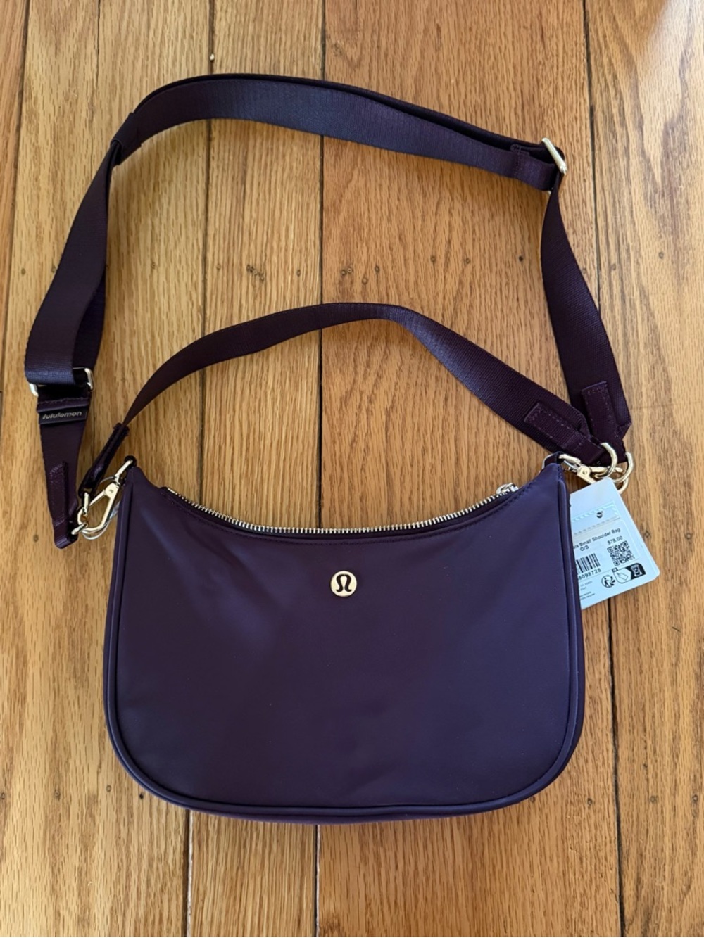 lululemon athletica Deep Plum Crossbody Bag with Gold Hardware